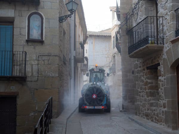 Miguel Angel Caldu, a farmer, disinfected the narrow streets of Valderrobres this month with a spreader normally used to fertilize his vines and fields of almond trees.