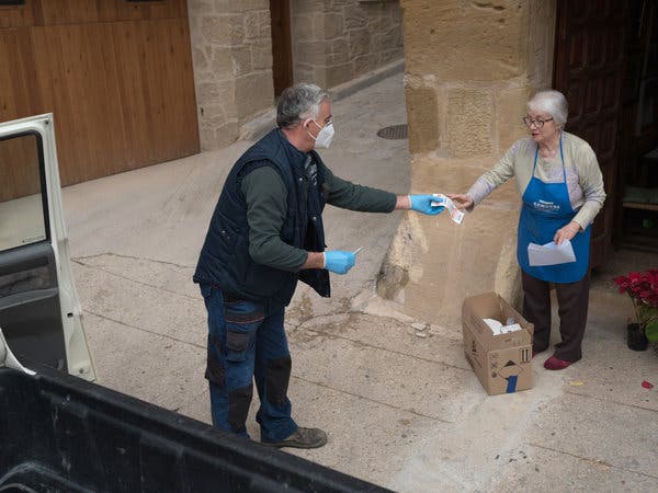 Alberto Ribes delivering food to Alicia Micolau in Valderrobres.