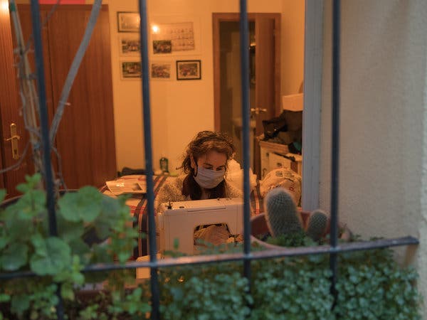 Sara Lombarte sewing masks at her home in Peñarroya de Tastavins.